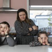 Elena Leeming, 39, with her two children Violet, five, and Clive, six, pictured at their home in York. Picture: SWNS