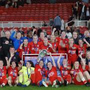 York City Ladies are pictured with their county cup silverware.