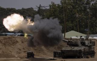 An Israeli mobile artillery unit fires a shell from southern Israel towards the Gaza Strip, in a position near the Israel-Gaza border, Monday, May 13, 2024