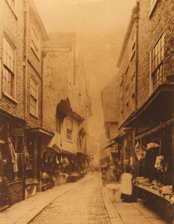 This image of Shambles from 1873 has information with it that claims that the year before the image was captured there were 39 shopkeepers in 'The Flesh Shambles,' 25 of whom were butchers.
