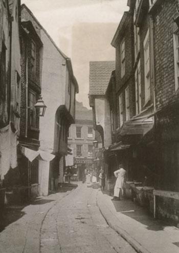 Date unknown, but the street was then referred to as The Shambles, and not just Shambles as it is today. The shop at the end has a sigh that reads 'Nicholson's furniture store.'