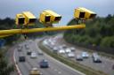 Speed cameras above a motorway.  Picture: Newsquest