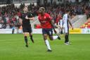 Dipo Akinyemi celebrates his opener in York City's 2-2 draw with Bromley.