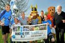 All set for the Taking The P 5k run are, from left, Neil Gulliver, Norris The Knight, Brian Hughes, Berwick Kaler, Vinny Viking, Danial Parker of York City, Daniel Annis of York Cancer Research, Yorkie the Lion and Prof Norman Maitland