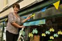 Pat Swift decorates her shop, Norton Aquaria, with Tour de Yorkshire buntingPicture: