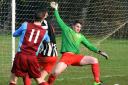 Dringhouses striker Matty Mulhearn sees his shot saved by Osbaldwick keeper Tom Young Picture: Nigel Holland