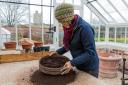 Left and below, Helen Fletcher preparing for and seed sowing at Helmsley Walled Garden, as the cold weather forces her inside