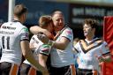 Tim Spears celebrates with Liam Harris after Knights’ opening try Pictures: Gordon Clayton