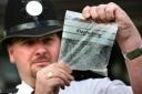 Sergeant Mick Irwin with a sample of Mephedrone.