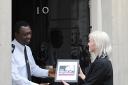 Press reporter Jennifer Bell hands in our petition at 10 Downing Street