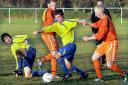 Huntington Rovers player Neale Holmes battles for possession