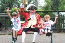 Pocklington Montessori School pupils enjoy ringing their bells and shaking other   musical instruments with town crier Geoff Sheasby