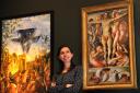 Laura Turner, curator of Art at York Art Gallery, with the two Mystery Plays paintings on display. Johny Smyth’s York Mystery Plays 2012, left, and Stanley Spencer’s The Deposition and Rolling Away Of the Stone