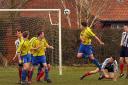 Huntington Rovers’ James Edmonds leaps above the Dunnington defence and then celebrates, inset, putting his team a goal up against the leaders, but Dunnington hit back to win 2-1
