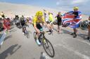 Fans get close to the  action as Chris Froome heads for victory in the 2013 Tour de France