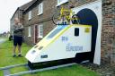 Graham Cookman, with his Tour de France Eurostar themed display, outside his home in Stillington.