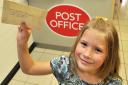 Matilda Humpleby, 6, being served by Brenda Robinson at the new post office in Norton where she became the first customer when she went in to buy a stamp for a letter to the Queen     Picture: David Harrison