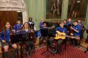 Members of the Lord Deramore's Primary School orchestra in York's Mansion House