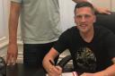 DAN'S THE MAN: Blyth Spartans' 25-goal, top-scorer Dan Maguire puts pen to paper for York City, watched by assistant-manager Micky Cummins