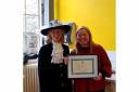 High Sheriff of North Yorkshire Mrs Clare Granger presenting the award to Katie Matthews, creative director of Dandelion Arts
