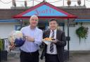 Scotts Fish and Chips proprietor Tony Webster, left, and Will Zhuang, outside the A64 chippy