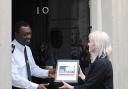 Press reporter Jennifer Bell hands in our petition at 10 Downing Street