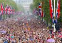 Crowds of well-wishers are led down The Mall, London, towards Buckingham Palace, following the royal      wedding at Westminster Abbey