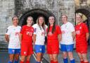 York City Ladies pose in their new home and away kits.