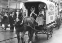 Father Christmas takes a ride in a horse-drawn delivery van from the Hunter & Smallpage store in York in 1975