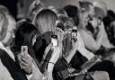 The crowd take photographs during last year's York Fashion Week