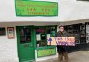 Gordon Campbell-Thomas with his sign protesting outside the Happy Valley Chinese restaurant in Goodramgate, York Image: Haydn Lewis