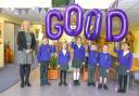 Our Lady Queen of Martyrs head teacher Emma Barrs with pupils as the school is rated 'good' by Ofsted