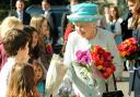 The Queen receives flowers from children outside the Yorkshire Museum