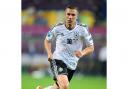 Lukas Podolski marked his 100th appearance from Germany with a goal against Denmark