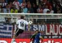 Germany's Philip Lahm scores the opening goal of the game
