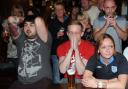 England fans show their despair watching England lose on penalties on the big screen at the Five Lions in Walmgate, York