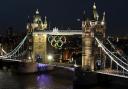 The Olympic rings are lit up on Tower Bridge, London, in preparation for the start of the 2012 London Olympics.  The rings were made by Stage One, based in Tockwith