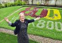 Coun Sonia Crisp with the York 800 floral display