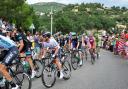 Chris Froome (centre) and Team Sky, with Mark Cavendish (second left) climb into Grasse during Stage Five of the 2013 Tour de France between Cagnes-sur-Mer and Marseille.