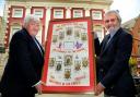 Michael Calpin, grandson of World War One veteran Ernest Calpin, meets the Lord Mayor of York, Councillor Ian Gillies, at the Mansion House. They are holding the framed photgraphs of the Calpin family that sent ten sons to the war