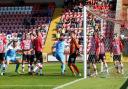 Central kingpin Keith Lowe powers his equalising goal past Exeter City’s Christy Pym
