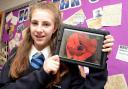 Huntington School pupil Alice Fox, 13, with her prize of an iPad after winning The Press’s secondary school First World War poetry competition with her entry, Lest We Forget