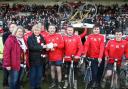 JOURNEY’S END: Organiser Ian Jones hands over the fruits of the York City fans’ cycling labours