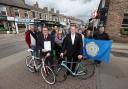 Preparing for the arrival of the Tour de Yorkshire are Gary Verity, chief executive of Welcome To Yorkshire, front right, and Johnny Hayes, front left, chairman of the Bishy Road Traders Association, with traders and residents from Bishopthorpe Road