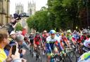 SWEAT AND GEARS: Riders in the Tour de France Grand Départ pass York Minster last year;
