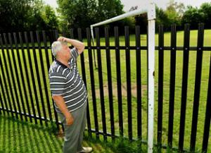 fence through football pitch