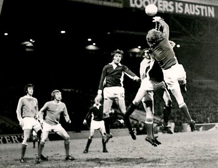 5/12/73: Manchester City 4, York City 1 (League Cup replay) - Keeper Keith MacRae punches away from Jimmy Seal with Chris Jones close by.