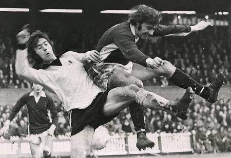 10/02/74 - York City 2, Watford 2: Barry Lyons and Watford defender John Williams go up for a high ball.