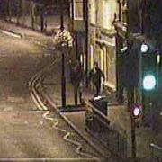 Two people are seen at 2:05am walking along Church Street, heading in the direction of the scene of the fire