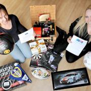Michelle Bell, left, and Laura Thomson, with the items including a Manchester United signed football which will be auctioned at the Quaker Wood pub  in aid of a memorial for Sean Hamilton